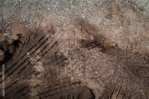 Wheel tracks on the soil road background or texture