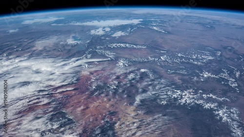 Day Earth Slow Rotation White Clouds Colorful Mountains From ISS.
Source material provided by NASA.