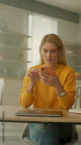 Woman managing social media tasks, Woman multitasking by monitoring notifications and scheduling content