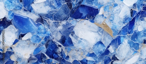 A mesmerizing mosaic of deep sapphire and icy white minerals intertwined with subtle golden accents.