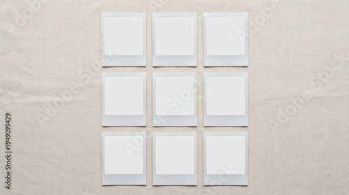 A minimal flat lay of multiple blank polaroid photos arranged on a surface