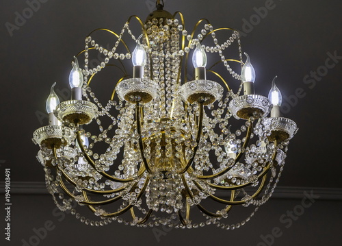 Luxurious chandelier with crystal pendants, stylized in antique style