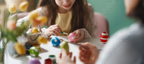 Joyful Family Easter Egg Painting Activity, Child Decorating Colorful Eggs at Home