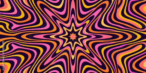 A vibrant swirling kaleidoscope pattern with orange pink and purple hues