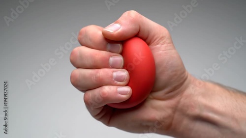 Hand Squeezing Red Stress Ball