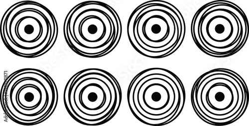 Ocho círculos concéntricos con espirales y un punto central negro en cada uno.