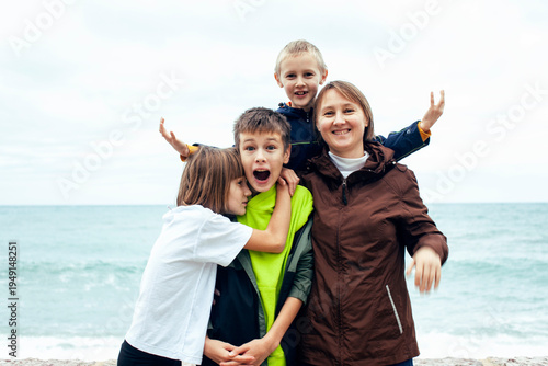 mother with children shooting on phone outside, happy memory, lifestyle people concept