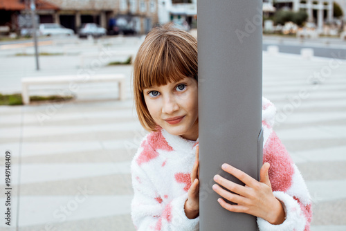 little cute blond girl curious smiling playing outside on sea, lifestyle people concept