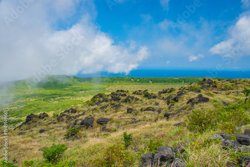 green field and blue sky