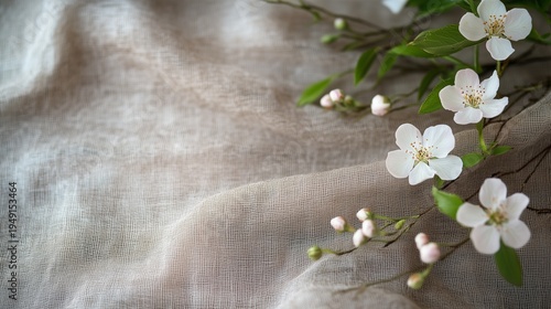 White Flowers and Fabric Create a Soft Arrangement on a Light Background Duri...