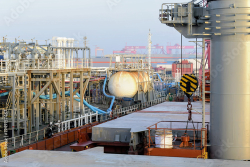 Billede på lærred a chemical tanker and bulk carrier are docked at guanjzhou harbor handling hazar