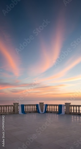 Beautiful sunset view from a stone terrace overlooking the calm sea