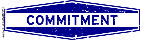Grunge blue commitment word hexagon rubber seal stamp on white background
