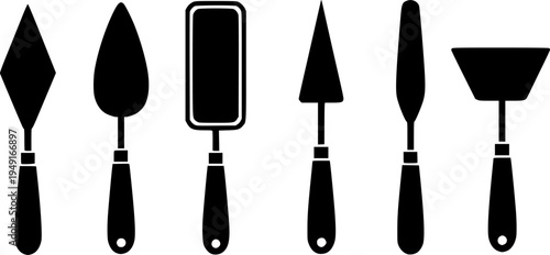 Set of six black and white palette knives with different blade shapes
