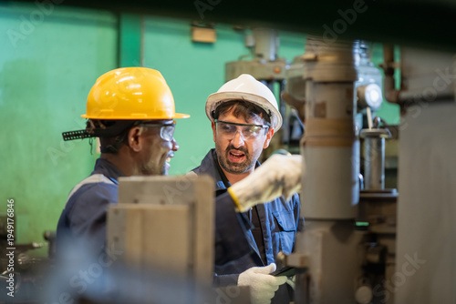 Fotografie Collaboration in the workplace manufacturing facility teamwork interaction indus