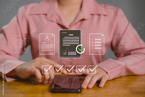 Businesswoman using smartphone to verify digital documents with checklist interface, online approval workflow, electronic signature, document management and secure business verification concept.