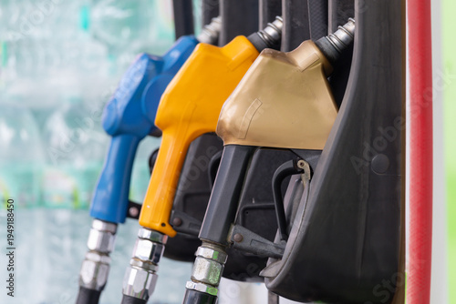 Wallpaper Mural Three fuel nozzles stand ready, each color distinct Torontodigital.ca