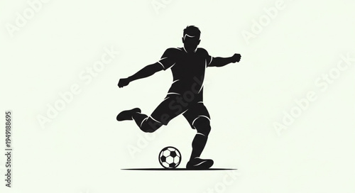 Silhouette of a soccer player kicking a ball.
