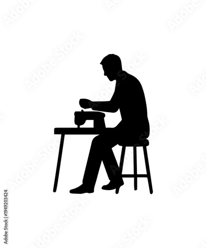 Man silhouette sewing at a table on a stool