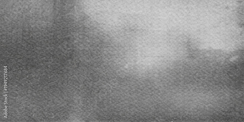 A dark, textured black and grey leather surface features a rough, grunge pattern ideal for a blank material background or closeup textile wallpaper design