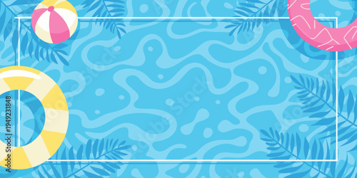 Summer themed flat lay with beach balls floats and tropical leaves