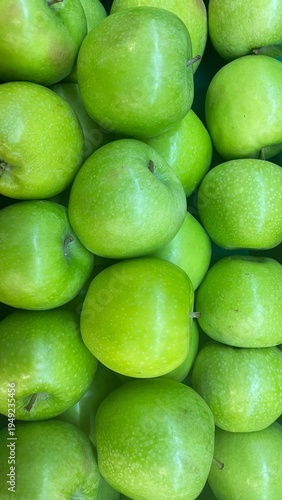 Fresh ripe green apples as background