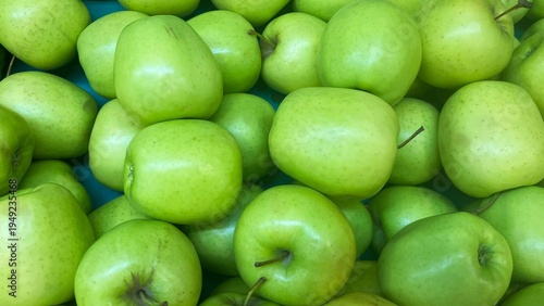 Fresh ripe green apples as background