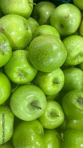 Fresh ripe green apples as background