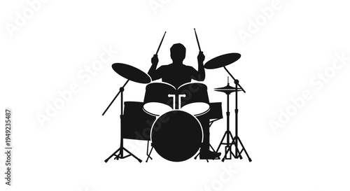 Drummer playing drum kit silhouette.