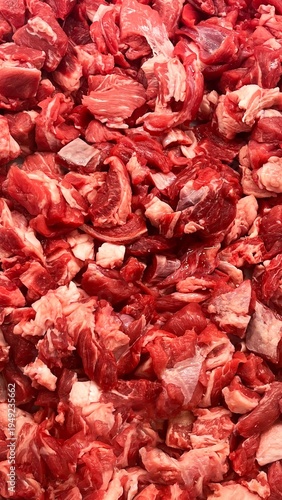 Close-up of fresh raw veal cubes for cooking, meat texture background ideal for culinary and butcher concepts.