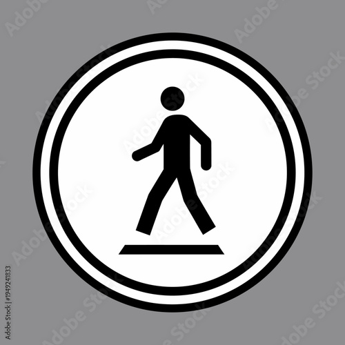 A pedestrian crossing sign displayed on a gray backdrop