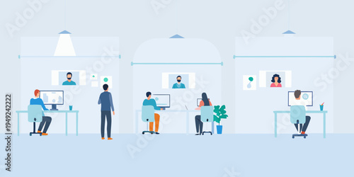 Modern office space with diverse employees working at computers and collaborating