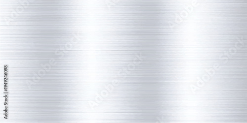 A polished silver brushed metal texture background features a shiny stainless steel surface and industrial grey aluminum plate pattern with a metallic titanium sheet reflection
