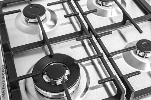 Contemporary stainless steel gas kitchen appliance with burners close up