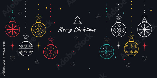 Festive christmas ornaments and a christmas tree on a dark backdrop