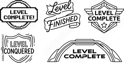 Collection of graphic badges and banners indicating game achievement like level complete and level conquered with varied artistic styles