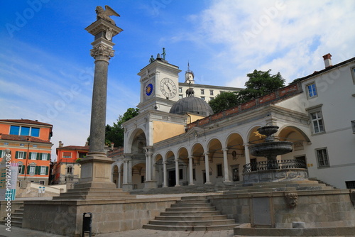 Historic European city square with clock tower, Udine, Italy