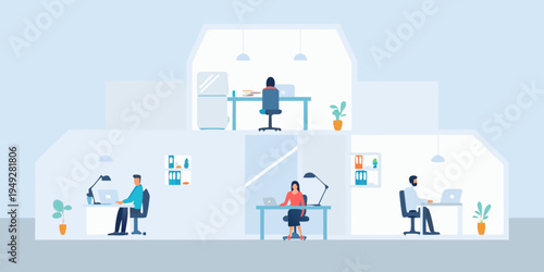 People working diligently in a modern open plan office space