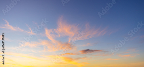 Breathtaking Vibrant Sunset Sky with Purple and Orange Pastel Clouds,A stunning twilight sky featuring a beautiful gradient of deep purple, soft pink, and vibrant orange. The scattered altocumulus.