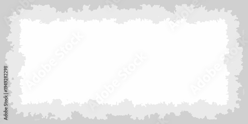 A torn paper edge with a neutral gray and white color scheme