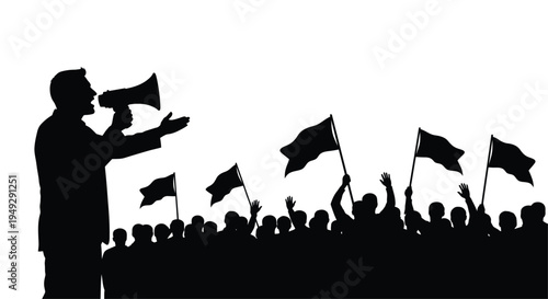A speaker addressing a crowd with waving flags a stark silhouette