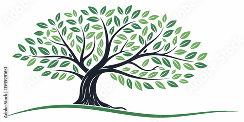 A majestic tree with lush green leaves standing tall on a grassy landscape