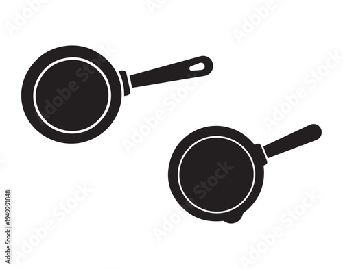 A simple black frying pan illustration viewed from above silhouette.
