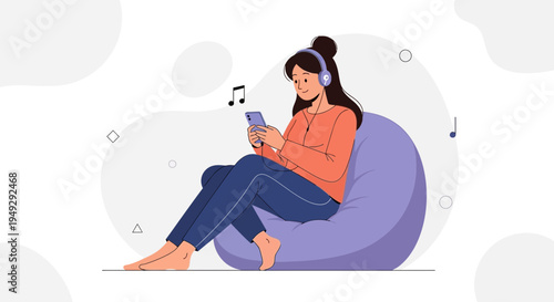 Young Woman Listening Music on Headphones with Smartphone While Relaxing on Bean Bag Chair