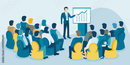 A businessman presents to a seated audience during a business meeting