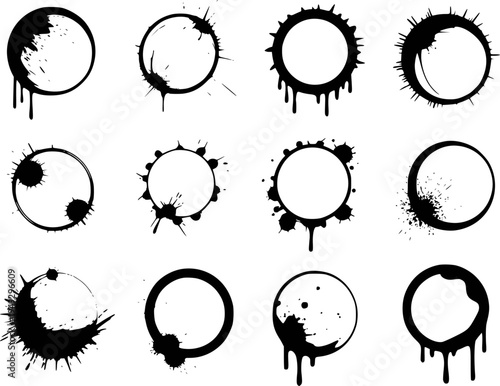 Collection of black ink splatters forming circular frames with drips and splashes