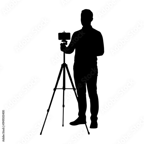Silhouette of a man using a smartphone on a tripod for professional video production, vlogging, and digital content creation.