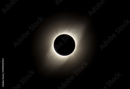 Close up of a total solar eclipse with corona around the Sun