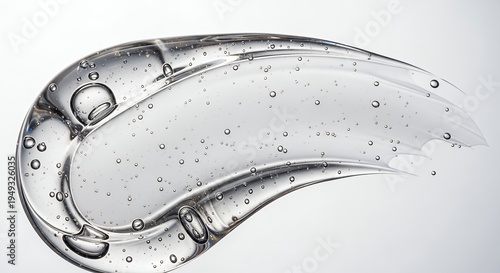 Transparent cosmetic gel smear with tiny air bubbles, showcasing a smooth, viscous texture on a pristine white background, perfect for beauty, skincare, and scientific product concepts.