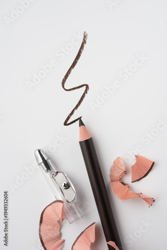 Sharpened Eyeliner Pencil with Shavings on White Background